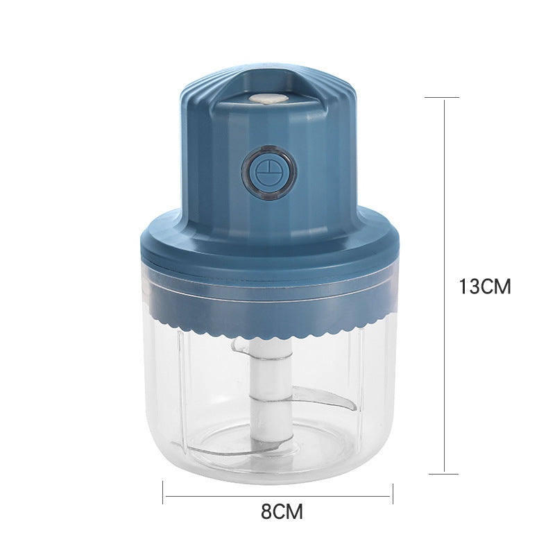 Blue hand chopper with clear container and measurements on a white background