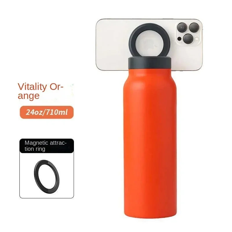 Orange water bottle with black cap and magnetic ring attachment on a white background