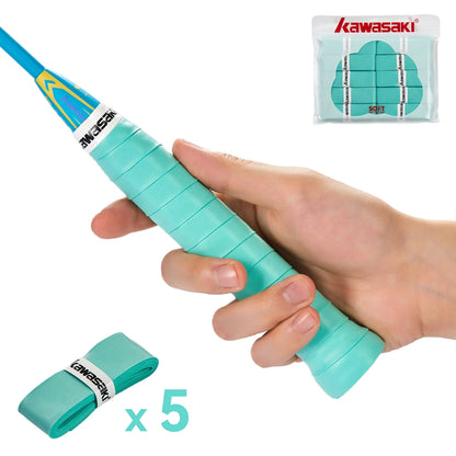Hand holding a turquoise badminton racket with Kawasaki packaging and additional rackets in the foreground.