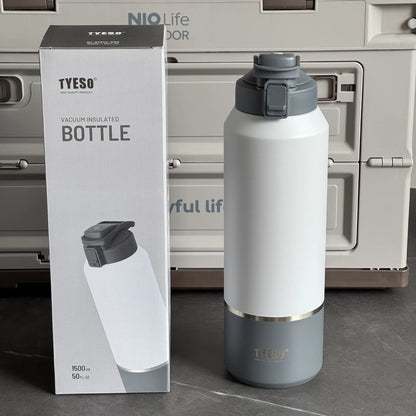 TYESO vacuum insulated bottle with packaging in front of a refrigerator.
