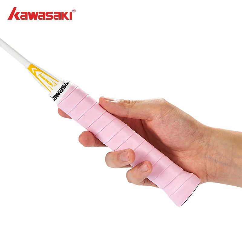 Hand holding a pink handlebar grip with Kawasaki logo on a white background