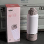 TYESO vacuum insulated bottle with packaging in front of a cooler