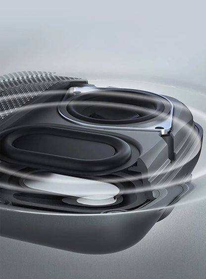 Close-up of a car's air intake system with a metallic finish.