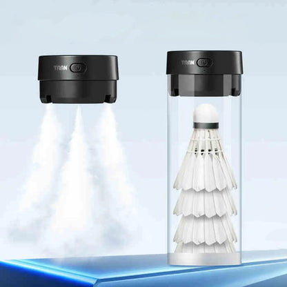 Two black devices with 'TAAN' branding, one emitting a white light and the other containing stacked white shuttlecocks.