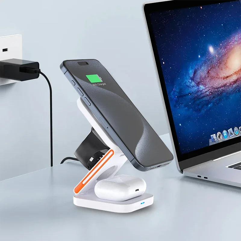 Wireless charging stand with phone, airpods, and laptop on a light gray surface.