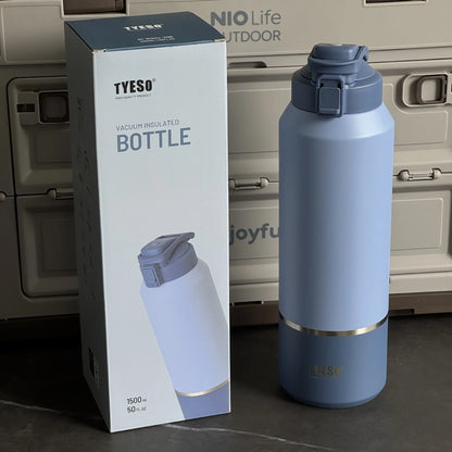 Blue TYESO vacuum insulated bottle with packaging in front of a vehicle