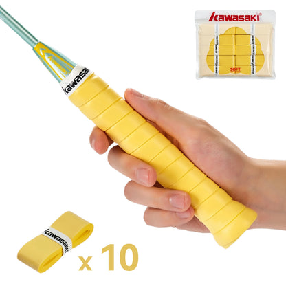 Hand holding a yellow badminton racket grip with Kawasaki branding, and a package of additional grips in the corner.