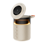 Beige smart speaker with a black circular top on a white background