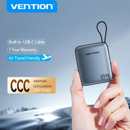 Vention power bank held by a hand with product features highlighted on a blurred background