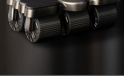Close-up of a mechanical device with cylindrical components on a dark background