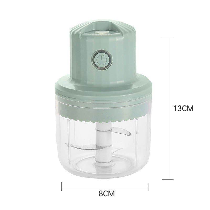 Green hand juicer with dimensions labeled on a white background