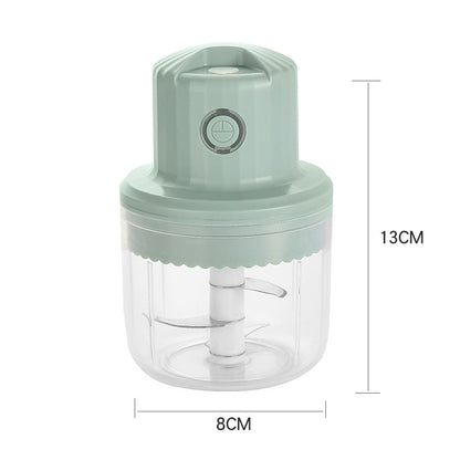 Green hand juicer with dimensions labeled on a white background
