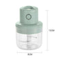 Green hand juicer with dimensions labeled on a white background